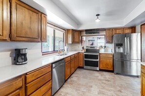 Fridge, microwave, oven, stovetop - Dog-friendly house on Alsea Bay with bridge views, grill & private hot tub (Waldport)