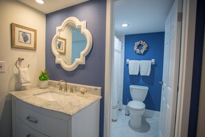 Shower, hair dryer, towels, shampoo