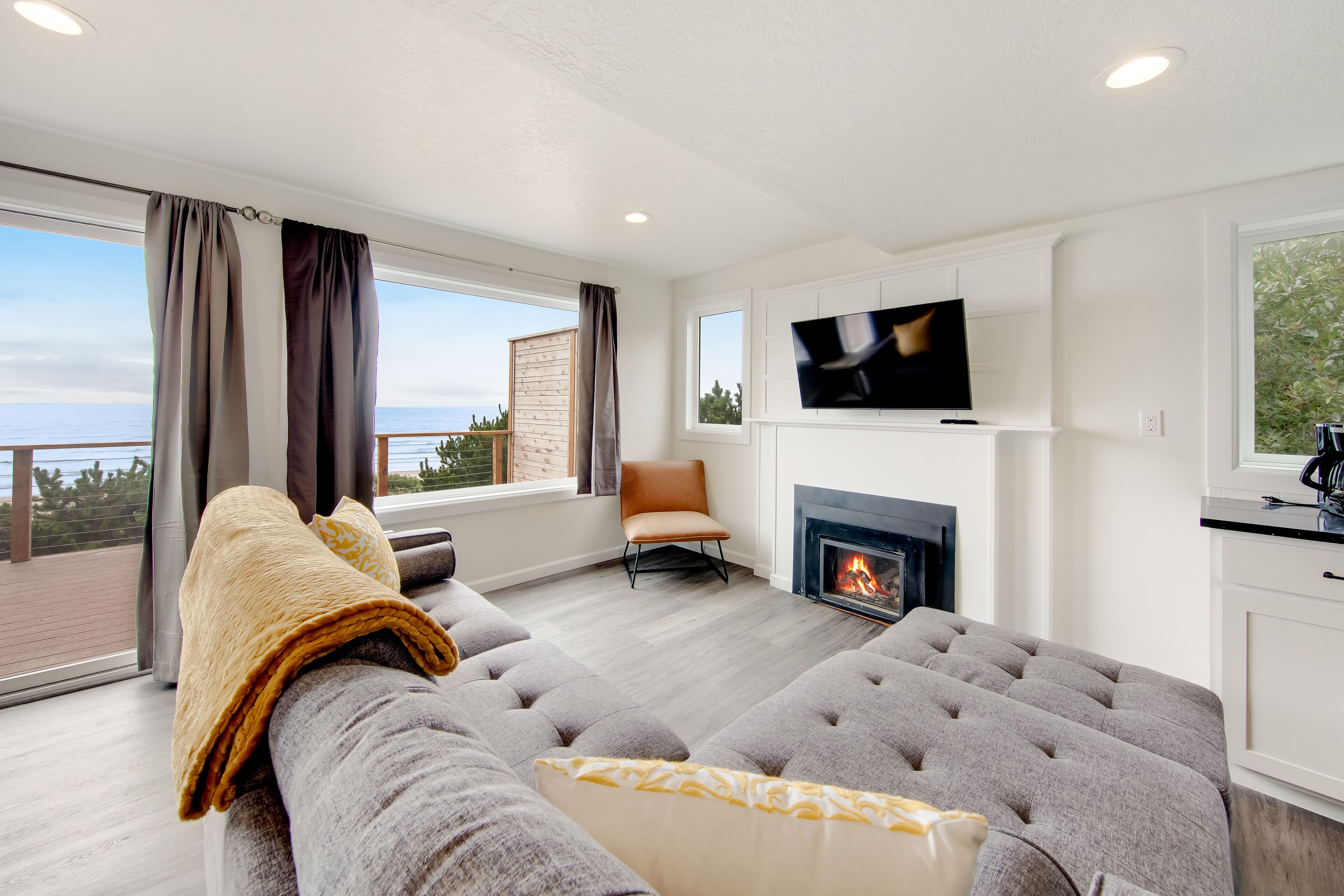 Dog-friendly oceanfront retreat with hot tub & relaxing deck facing the water