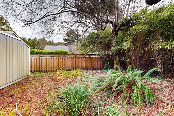 Enjoy a serene garden oasis with lush greenery and a tranquil atmosphere.