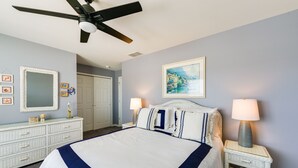 A neatly arranged bedroom with a bed, dresser, and two bedside tables with lamps. - Condo w/ Deck: Walk to Beach & Convention Center! (Wildwood)
