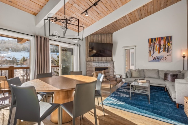 This top floor light filled condo with high ceilings has modern furnishings and decor