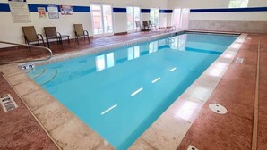 An indoor swimming pool with a tiled floor, a pool ladder, and a safety sign indicating a depth of 3 feet. - Arches East - 389, Downtown Moab 3-Bedroom Townhom (Moab)