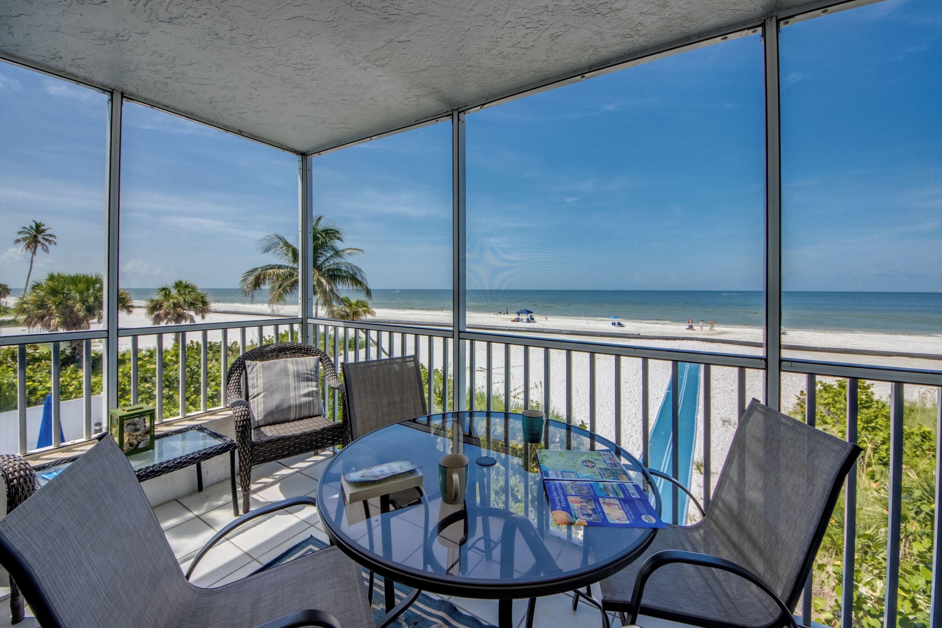 Beach Villas #101 - Private beachfront corner condo with screened-in lanai