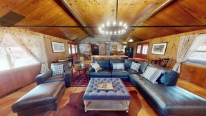 A cozy living room with a sectional sofa, a coffee table, and a fireplace. - Pack Creek - The Lodge (Moab)