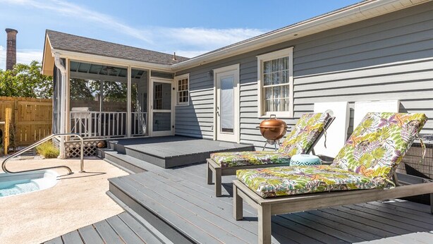 A deck with two lounge chairs and a hot tub. - Frogtown Cottage | Historic Downtown Savannah, Pool, Pet Friendly (Savannah)