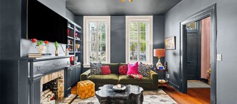 Stylish Row Home with Exposed Brick and Courtyard by Lucky Savannah