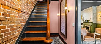 Two Story Row Home with Exposed Brick and Courtyard by Lucky Savannah