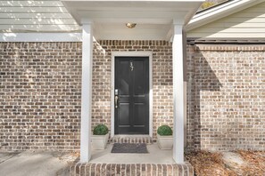 Exterior detail - Cozy Carriage House w/ Garage Parking 1 Block to River St. by Lucky Savannah (Savannah)