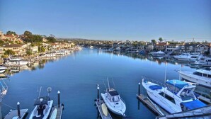 A marina with boats docked, surrounded by residential buildings.
