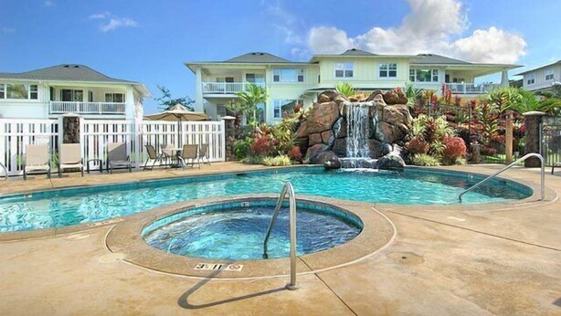 A hotel with a swimming pool, a hot tub, and a waterfall feature. - Plantation At Princeville 1521, A/C & 2nd Floor (Princeville)