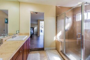 Shower, hair dryer, towels, shampoo