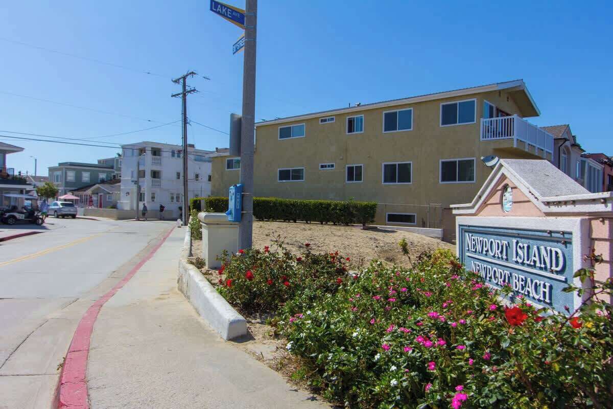 A building with a sign reading "Newport Island Newport Beach".