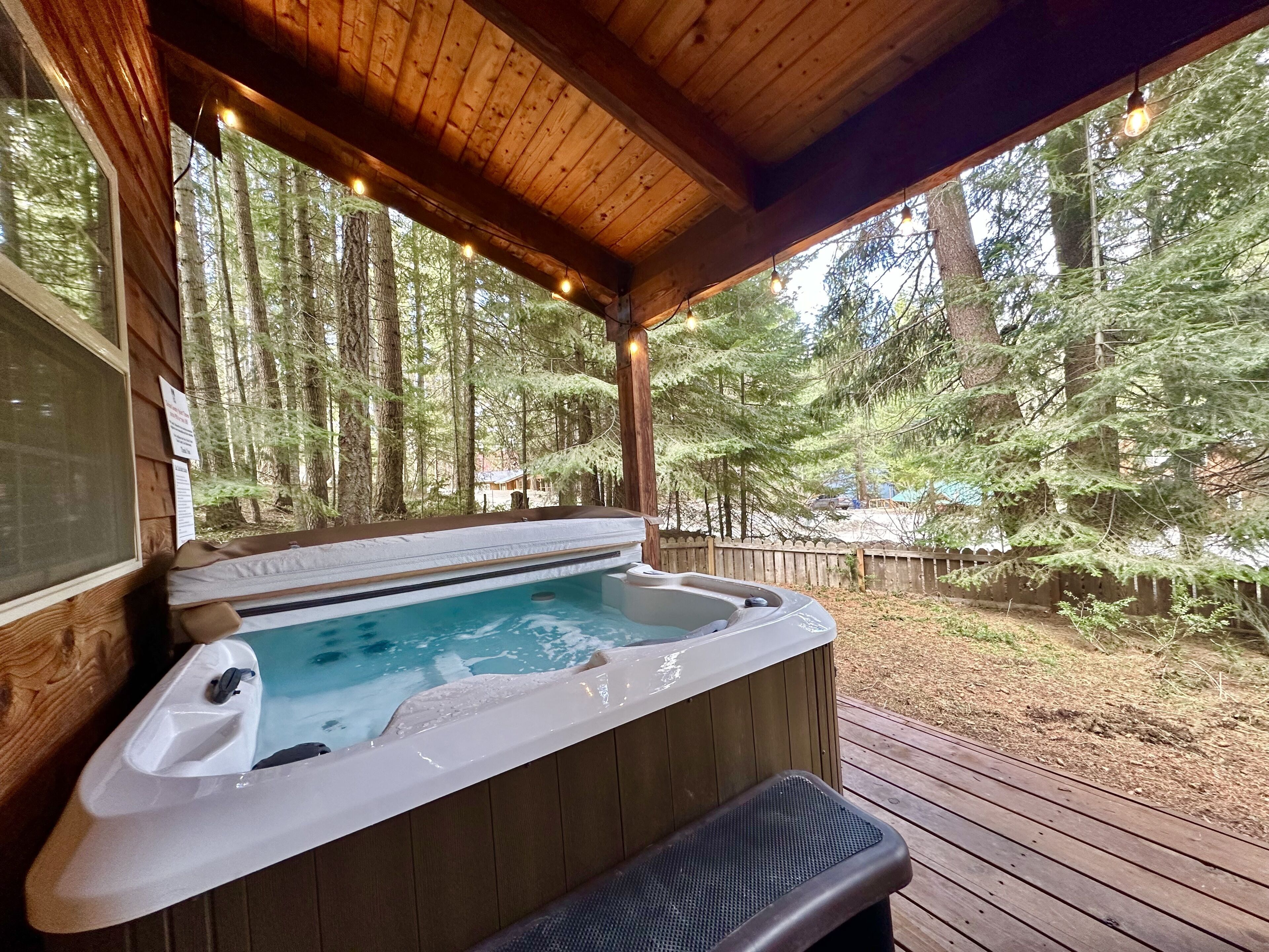 Private covered year round hot tub on the front deck space