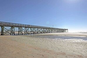 Guests can walk along the pier, taking in the serene views of the surrounding waters.