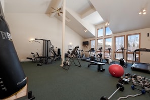 A gym with cardio machines, weightlifting equipment, and a punching bag. - Cascade Village Condo - Views/Heated Pool/Two Decks (Durango)