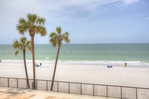 On the beach, beach towels, motor boating - Large Private Balcony with Beach View! Beachfront, Pool, Hot Tub, Grill, and Close to Restaurants (Madeira Beach)