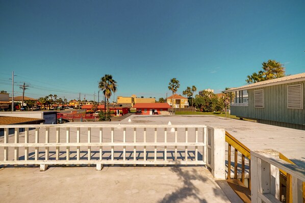 Stroll through a serene outdoor space surrounded by diverse buildings and lush palm trees.