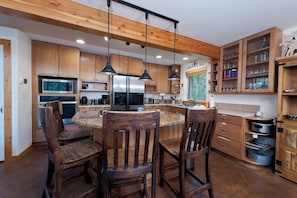 Oven, coffee/tea maker, cookware/dishes/utensils, dining tables