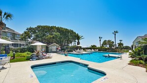 A pool area with two pools, lounge chairs, and a small building labeled 'POOL'. - Gorgeous dual-level ocean view unit located in Wild Dunes (Isle of Palms)
