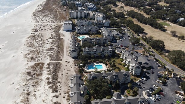 An aerial view of a coastal hotel with multiple buildings, a swimming pool, and a beach. - Wild Dunes condo with ocean views and sundeck (Isle of Palms)