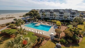 A resort with a large swimming pool, beach access, and a multi-story building with balconies. - Ocean view condo in Wild Dunes (Isle of Palms)