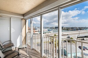 Enjoy breathtaking views of the marina and cityscape from this balcony.