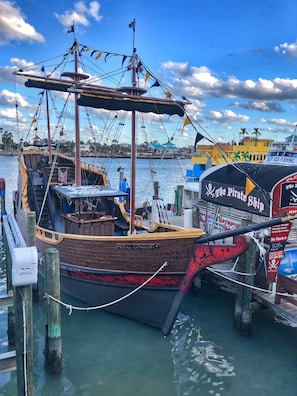 Experience the charm of the historic Royal Conquest ship, moored at the marina with its crow's nest and traditional rigging.