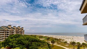 A beachfront hotel with multiple balconies overlooking the ocean. - Stunning oceanfront condo located in Wild Dunes with ocean and golf views (Isle of Palms)
