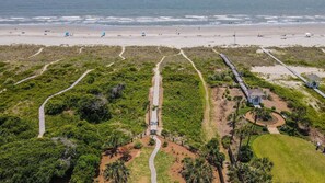 Aerial view of boardwalk and sandy path to beach