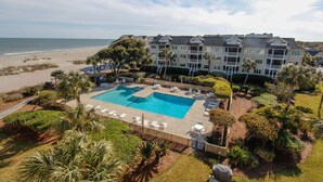 A resort with a large pool, beachfront view, and multiple-story buildings. - Ocean View condo in Wild Dunes (Isle of Palms)
