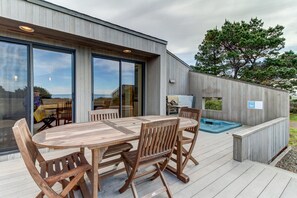 Relax on the outdoor deck with a hot tub and take in the views of the surrounding landscape.