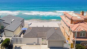 A coastal view with buildings overlooking the beach and ocean. - Pet Friendly Oceanfront Unit in Oceanside P1315-2 (Oceanside)