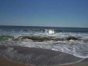 A beach with waves crashing onto the shore under a clear sky. - TB 68B Fantastic Condo Close To Pool/Golf Short drive to Beach/Shopping 68B (Pawleys Island)