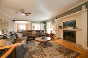 TV, fireplace, books - Inviting Colorado Springs House w/ Spacious Deck! (Colorado Springs)