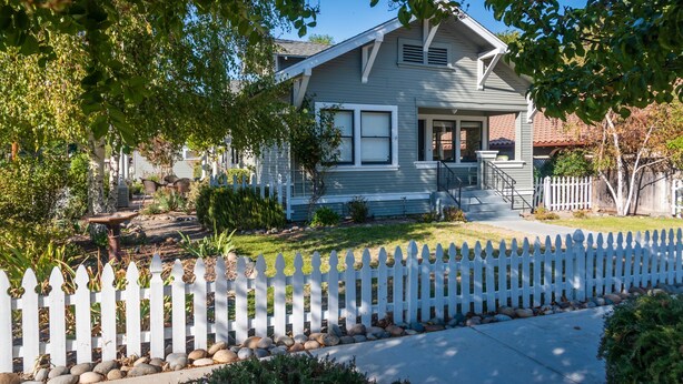 A single-story house with a front porch, a picket fence, and a well-maintained lawn. - 1916 Craftsman + Firepit | Walk Downtown | Poe House (Paso Robles)