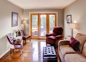 A warm, light-filled living room with comfortable seating and French doors opening to the deck. - Sleeps 8 + Large Private Deck + Ping Pong | Walk to Downtown | Vin Rouge 51 (Paso Robles)