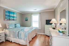 A bedroom with a bed, a TV, a dresser, and a window with curtains. - TB 13D 3Br/3Bath unit super nice with great view on golf course (Pawleys)