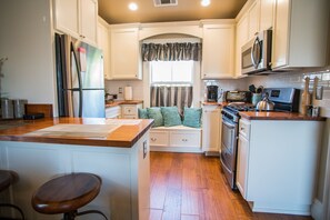 Fridge, microwave, stovetop, coffee/tea maker