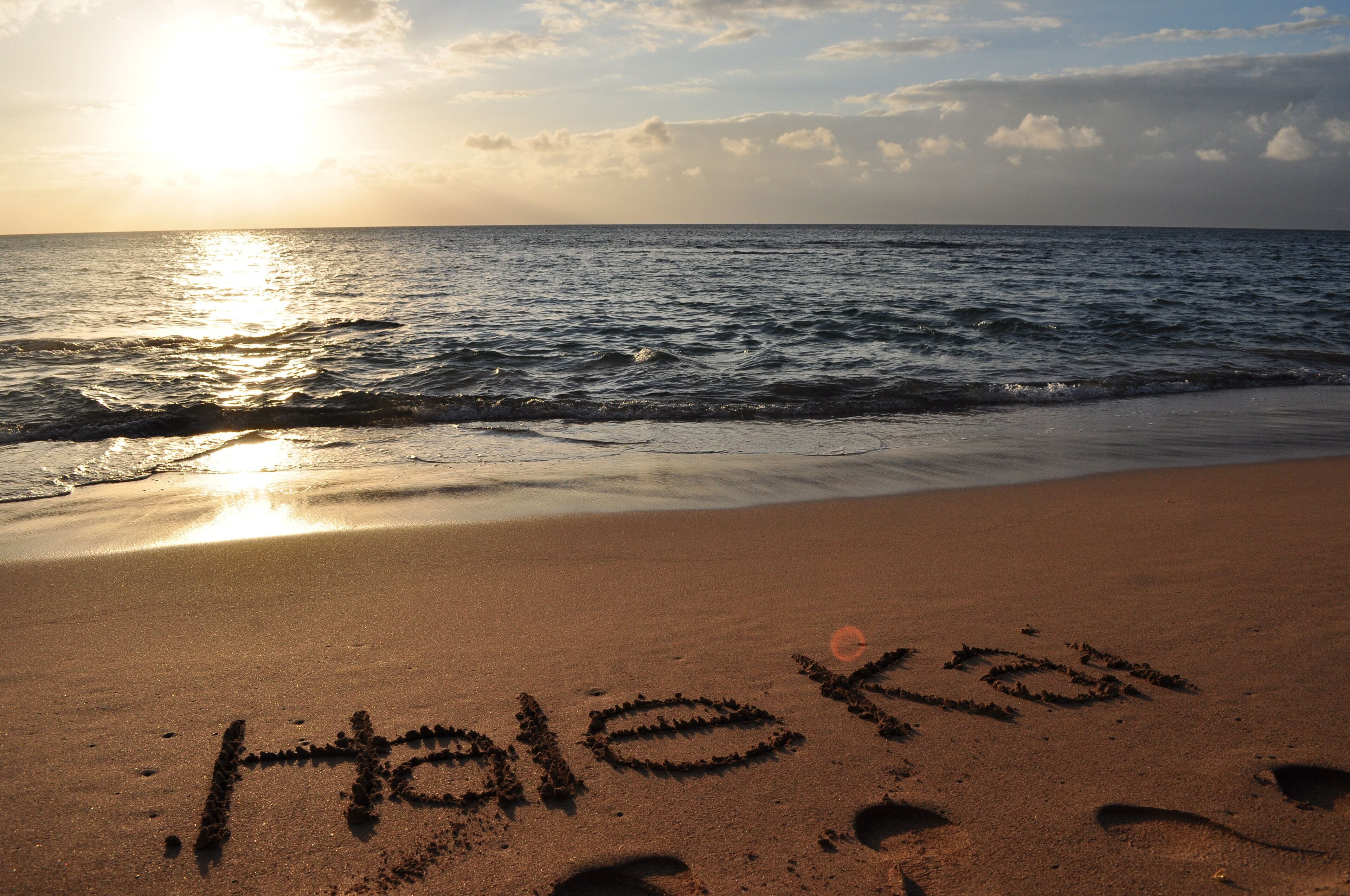 A beach with the word "Haleakala" written in the sand.