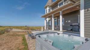 A house with a hot tub, a covered patio, and a view of the ocean. - PICKLEBALL!! Hot tub, ocean views, Pool & Ping Pong Table (Knole) (Long Beach)