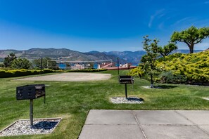 Enjoy a tranquil outdoor space with a lawn, mountain views, and a paved walkway.
