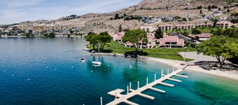 Lakefront condo with amazing views, pool, hot tub, beach access, and fireplace