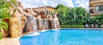 Ocean-View Haven with Shared Pool, Balcony, WiFi, and W/D - Near Beach