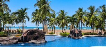 Upscale Beachfront Condo with WiFi, Spacious Balcony & Pool