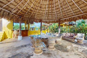 Outdoor dining - Waterfront villa with private pool, balcony, partial AC, fast WiFi - near beach (San Pedro)