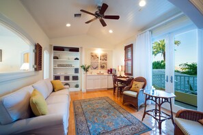 Flat-screen TV, DVD player, books, stereo