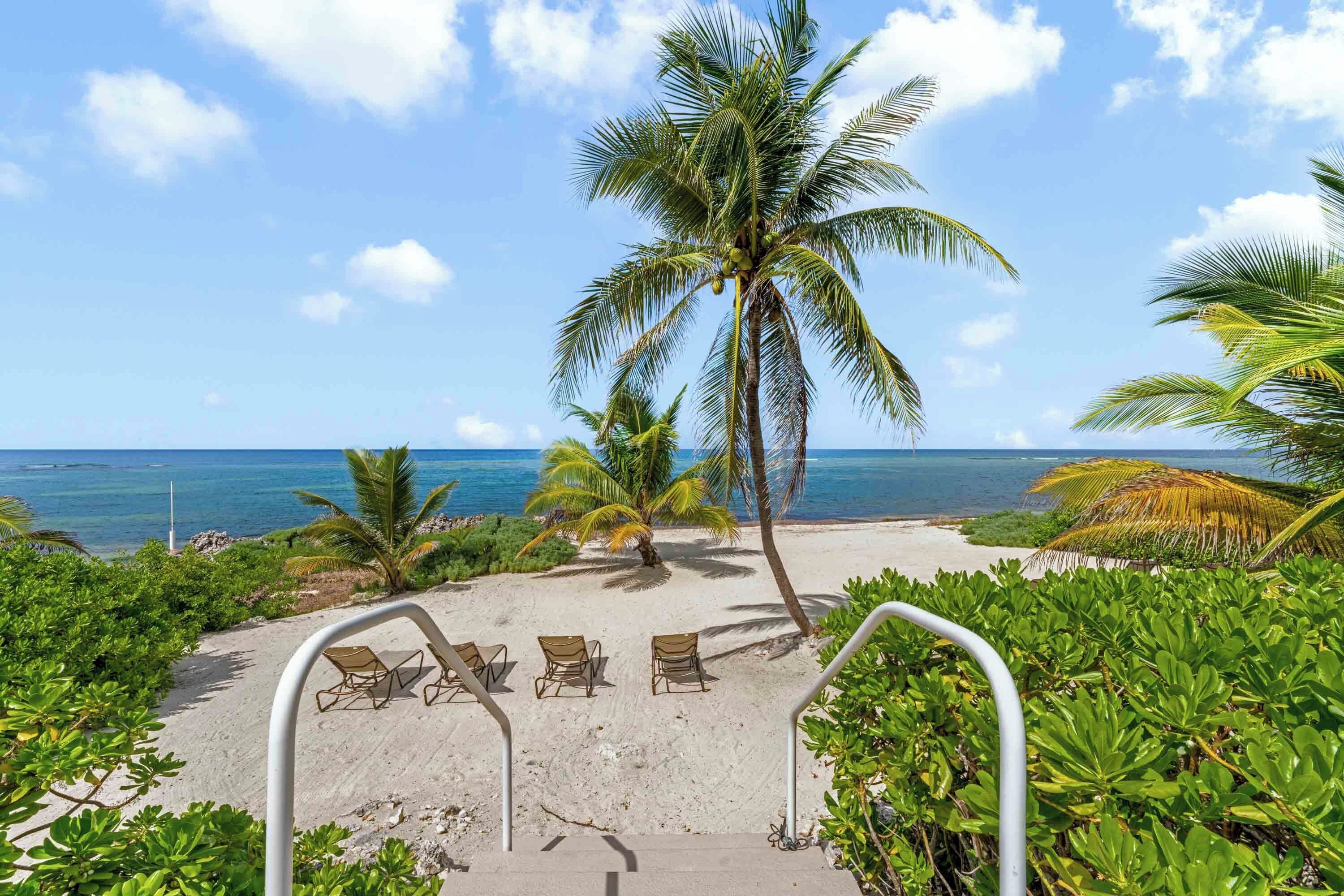 On the beach, sun loungers, beach towels