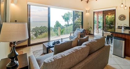 Exceptional Dog-Friendly Treetop Condo with Ocean Views & Breezy Balcony