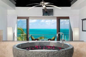 Master bedroom with tub overlooking Grace Bay Beach. 